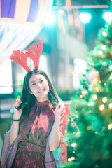 Merry christmas pine tree with beautiful asian women