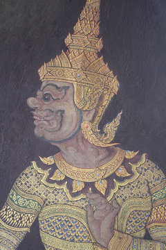 Painting of Ancient guardian giant monster god statue with scary teeth at royal template palace, signature of Thailand Travel destination backgrounds
