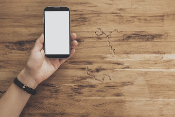 Top view of hands holding tablet table background
