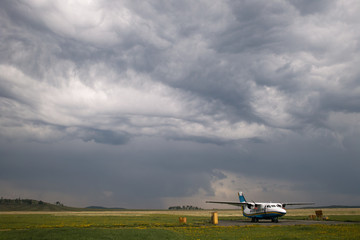 Fototapeta premium Storm sky above the airfield in the countryside.