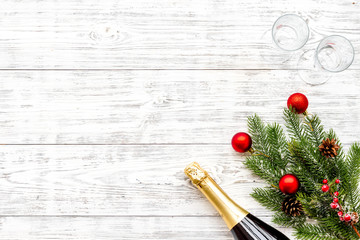 New year and Christmas party with spruce, champagne bottle and glasses on white background top view space for text