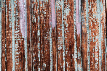 Downed wooden boards with peeling paint