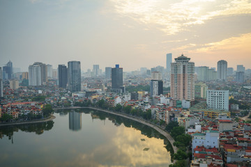 Fototapeta na wymiar Aerial skyline view of Hanoi city, Vietnam. Hanoi cityscape by sunset period at Hoang Cau lake, Dong Da district