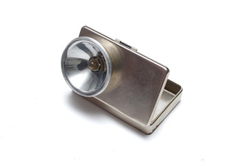 Metal retro style flashlight isolated on the white background.