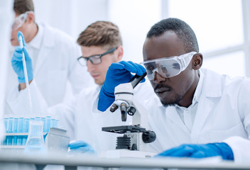 close up.a multinational group of scientists is conducting research