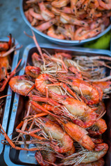River shrimp or river prawn grilled barbecue seafood . close up on fired food. Seafood grilled, lobster,shrimp, pawn on fire. fresh seafood barbeque. grill grab, shell, squeeze, shellfish on fire.