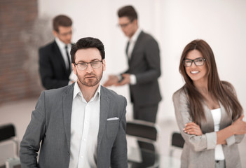 employees of the company standing in a modern office