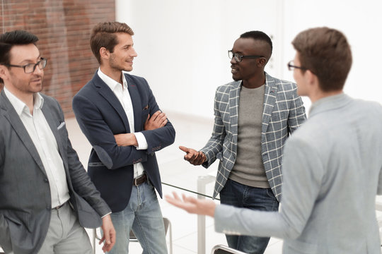 Multinational Business Team Having A Meeting On A Working Break