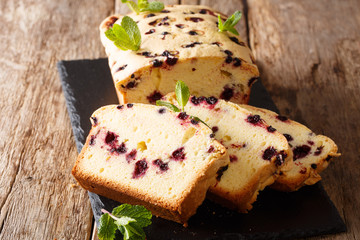 Baked sweet black currant cake with mint close-up. horizontal