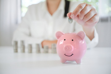 female hand saving money for future retirement plan