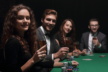 beautiful woman sitting at a table in a casino