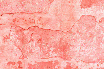 Texture, wall, concrete, living coral. It can be used as a background . Wall fragment with scratches and cracks