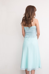 Fototapeta premium 水色ドレスの可愛い女の子顔なし