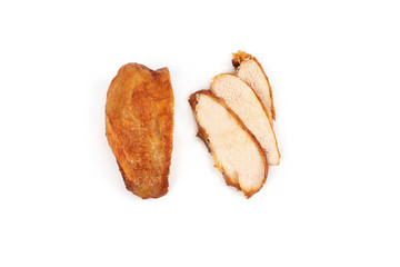 A close up of grilled, sliced chicken breast isolated on white background .