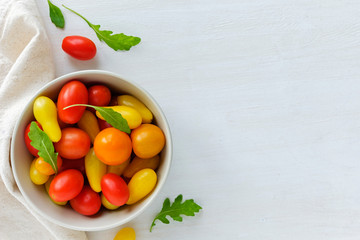 Bowl of red and yellow tomatoes