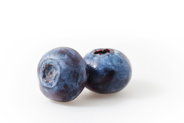 Fresh blueberry isolated on white. Two berries 