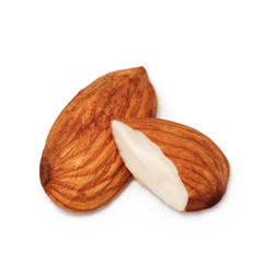 Almond close - up isolated on white. Whole almonds and half a nut