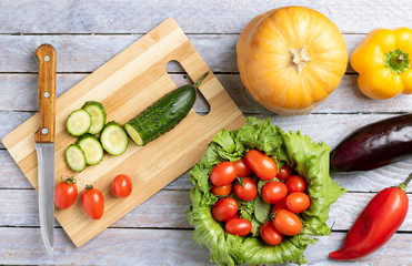 grey wooden table and raw vegetables
