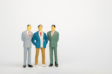 Group of figure miniature businessman or small people investor and office worker secretary on white background for money and financial business teamwork concept.