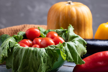 tomatoes cherry in salad leaves , copy space