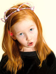 Cute redhead female child communicates her opinions