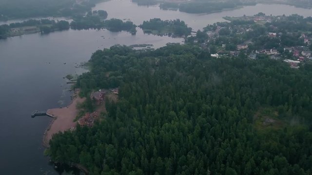 Aerial survey Mon Repos park in Old Vyborg, Russia, Monrepos north footage. Aerial footage forest panoramas foggy thick north forest, Island the Dead Mon Repos park. aerial video coniferous, pine tree