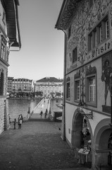 Fototapeta na wymiar Old vintage buildings and Rathaussteg bridge in old town Lucerne, Swizerland