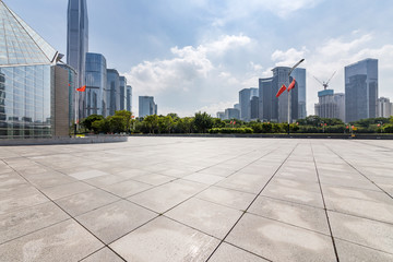 Fototapeta premium Panoramic skyline and modern business office buildings with empty road,empty concrete square floor