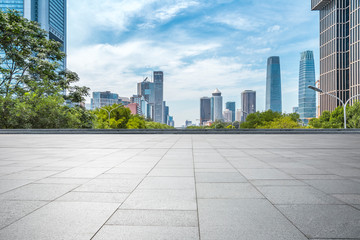 Panoramic skyline and modern business office buildings with empty road,empty concrete square floor