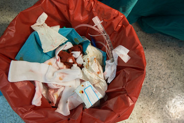 Dirty surgical garbage bin in the operating room