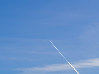 Airplane lelaving a trail in the sky