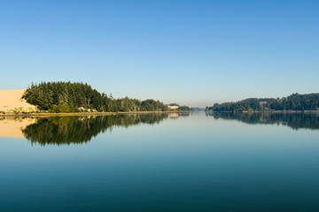 Coos River bay at its mouth next to the dunes of Oregon