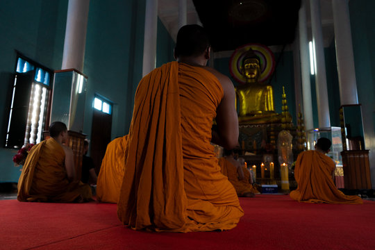 Monks praying in the buddhist temple