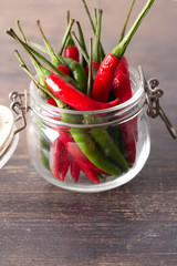 chili peppers in a glass jar.
