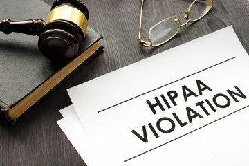 Documents about HIPAA violation and gavel in a court. - obrazy, fototapety, plakaty