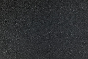 Rough textured black concrete background.