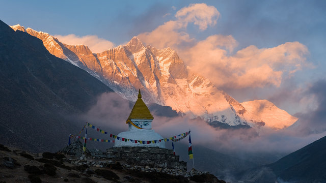 buddhist stupa sunset in the mountains