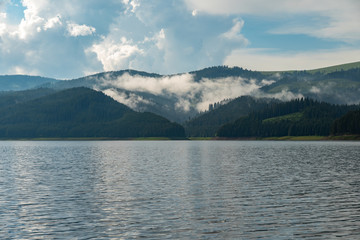 Mountain lake tranquil waters early morning 