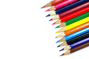 Multi colored pencils on white background