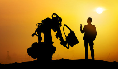 Robot assistant technology , industry 4.0 , artificial intelligence trend concept. Silhouette of business man talking to automation robo advisor arm. Bokeh flare light effect with sunrise background.