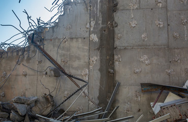 Demolition of the building. Dismantling of a house. Ruins of building under destruction. Industry.