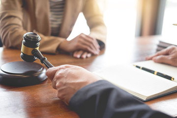 lawyer in office. Counseling and giving advice about legal legislation in courtroom to help...