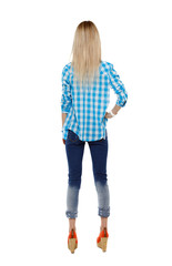 Back view of a woman in jeans.
