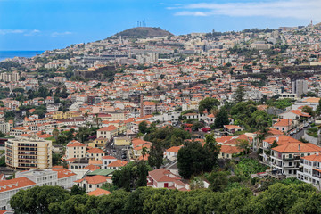 Fototapeta premium Panoramic at residential district in Funchal against blue sky. Portuguese island of Madeira