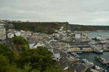 Obraz premium Aerial View Of The Port And The Houses Of The Town Of Luarca. July 30, 2015. Travel, Nature, Vacation. Luarca, Asturias, Spain.
