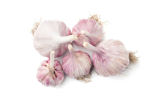 Heap of natural garlic isolated on white background