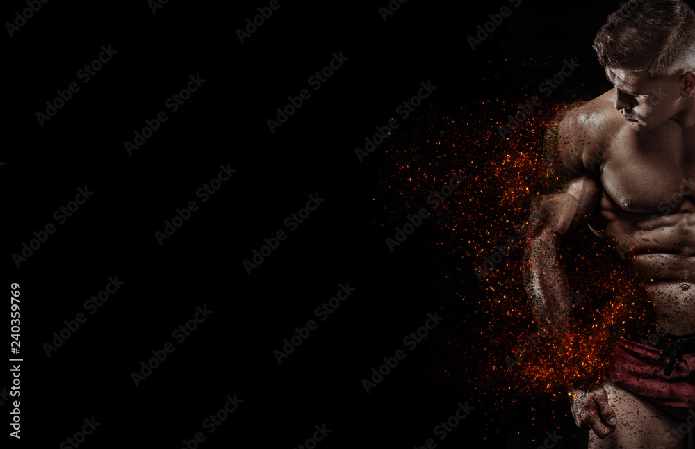 Wall mural Muscular fitness sports man, athlete in fitness gym. Fire and power. Copy space