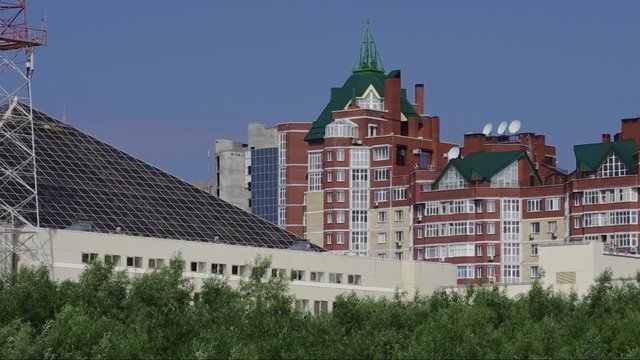 Surgut. Park Across the Saima - view of the building of Tyumenenergo.