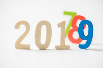 wood number 2019 for happy new year on white background