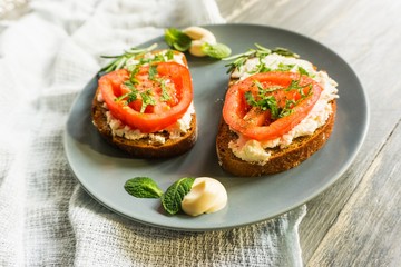 straw bales in harvested fields under blue sky